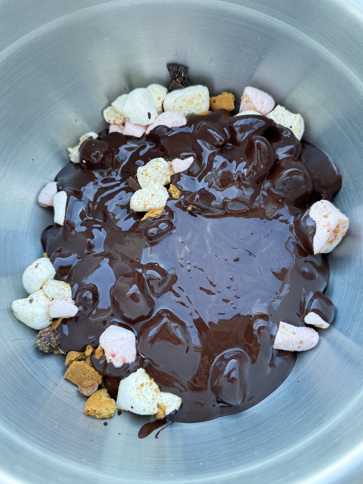 melted chocolate poured over mix ins