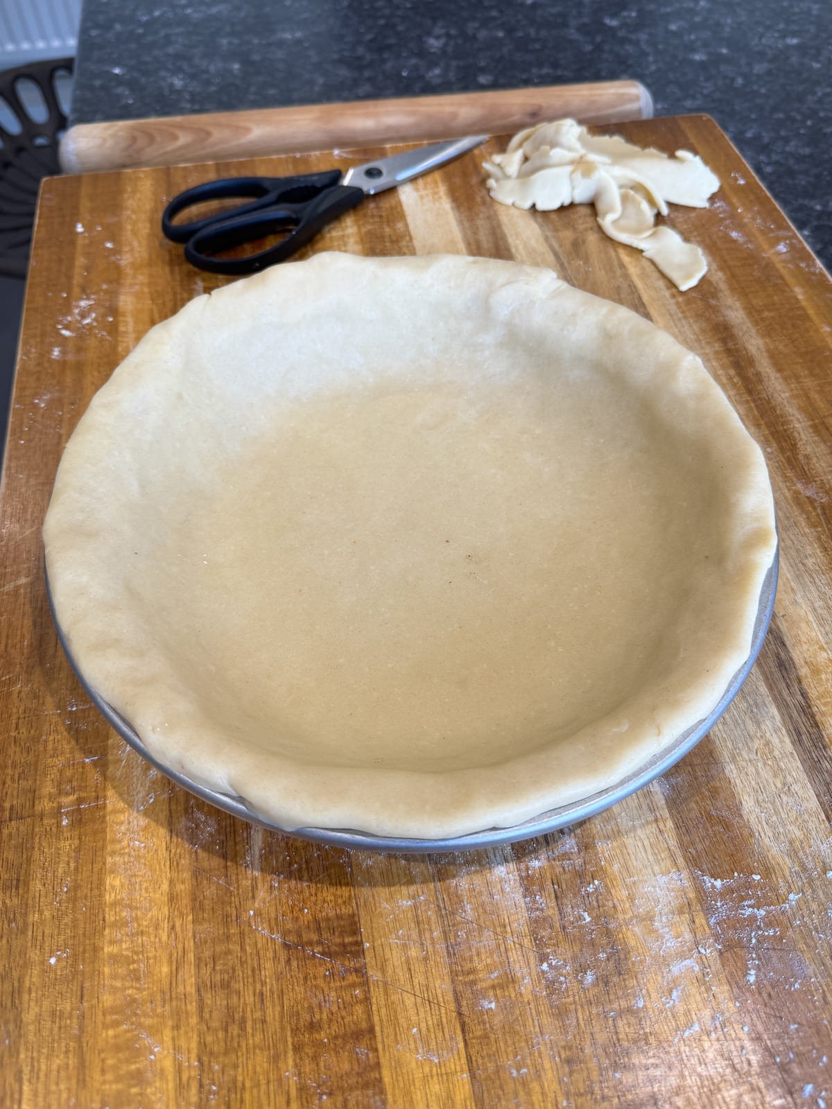 overhanging pie crust folded to make lip