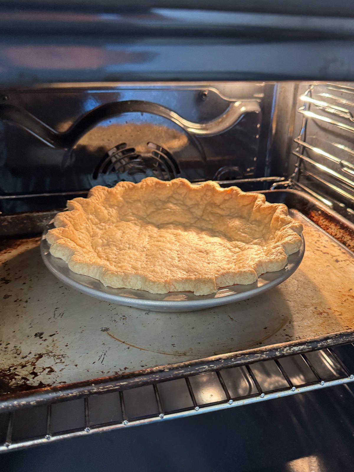 pie crust in oven on tray