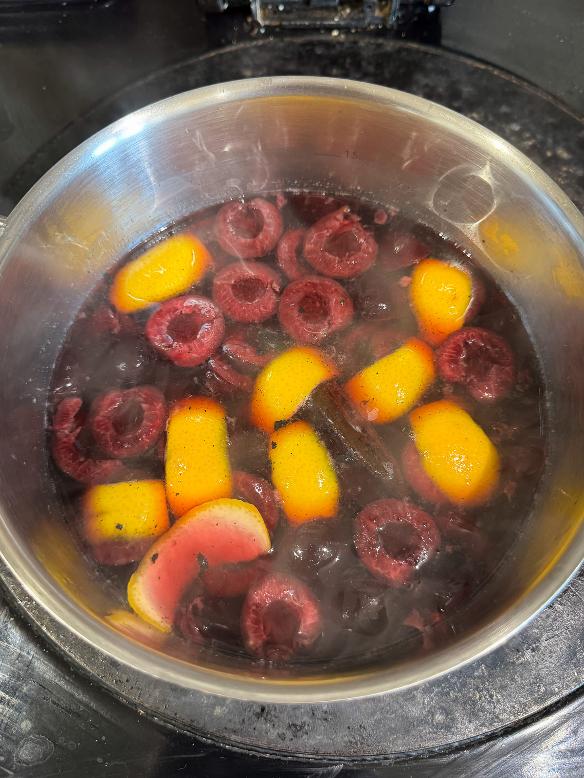 cherries poaching in orange