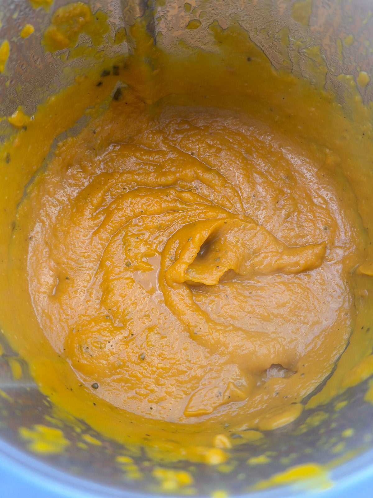 pureed pumpkin soup in jug blender