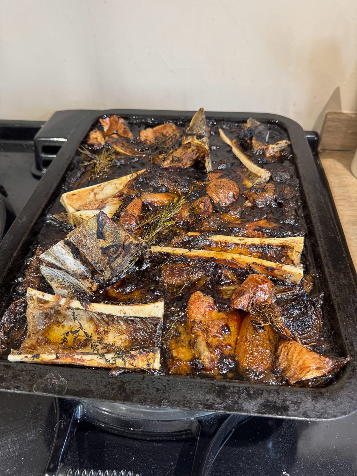 slow cooked roasting tin of beef stock