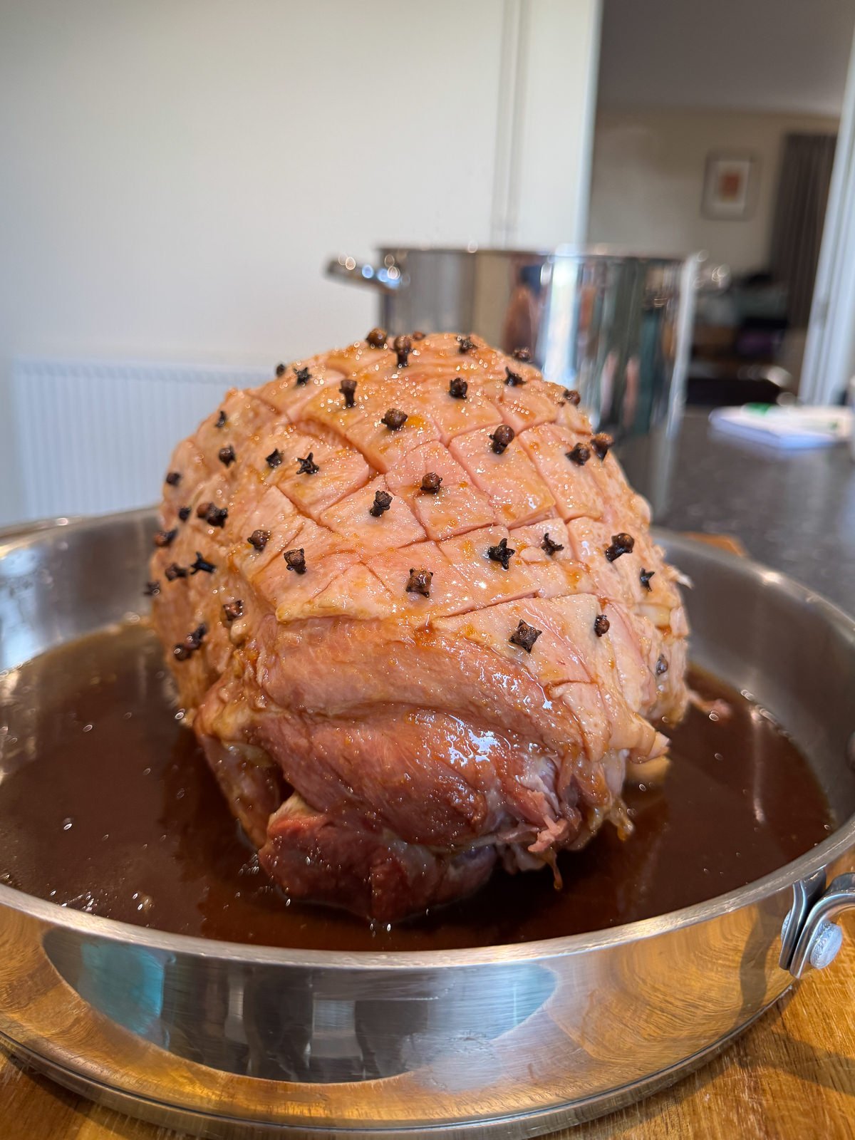 scored ham fat studded with whole cloves
