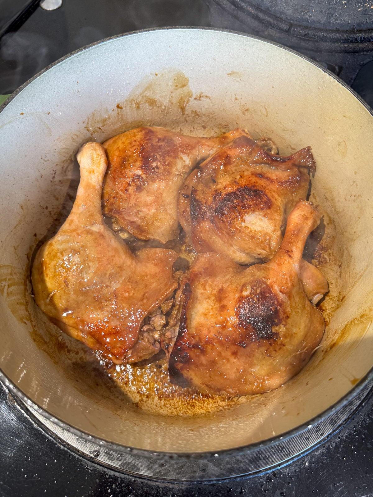 seared duck legs in pan
