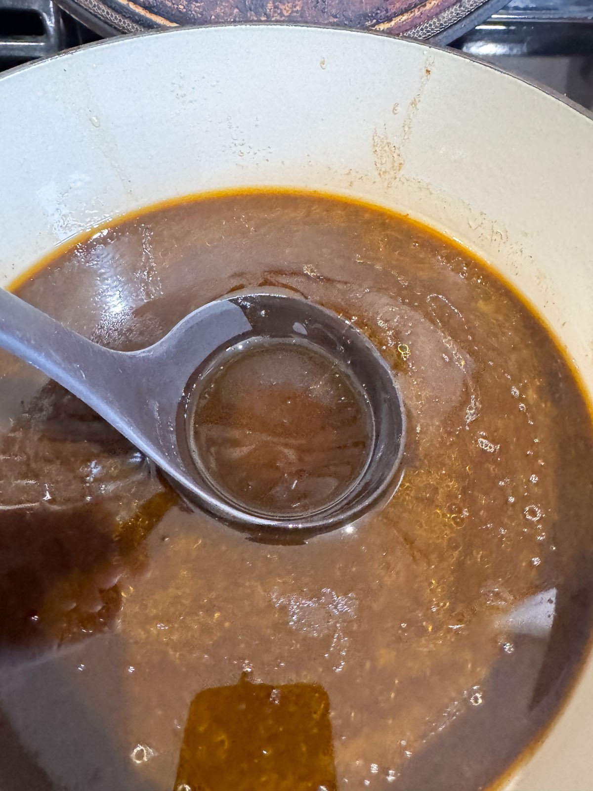 skimming fat off the top of beef stock