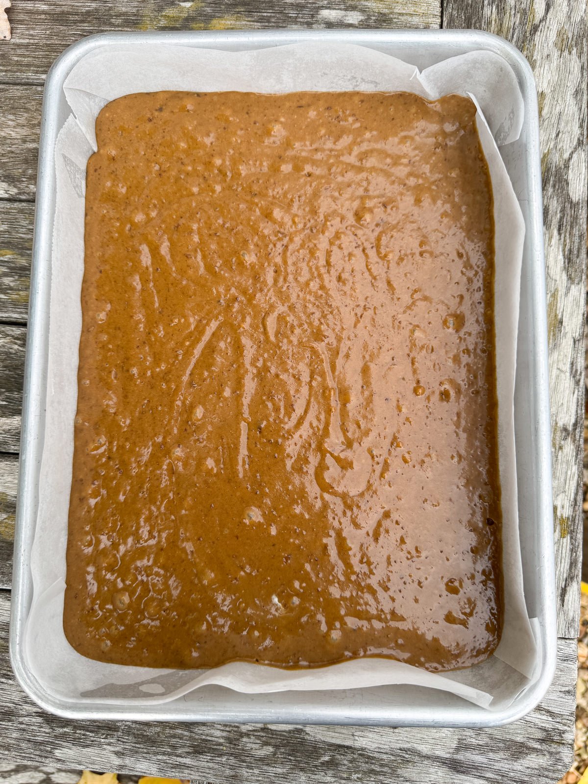 sticky toffee cake batter in deep traybake tin